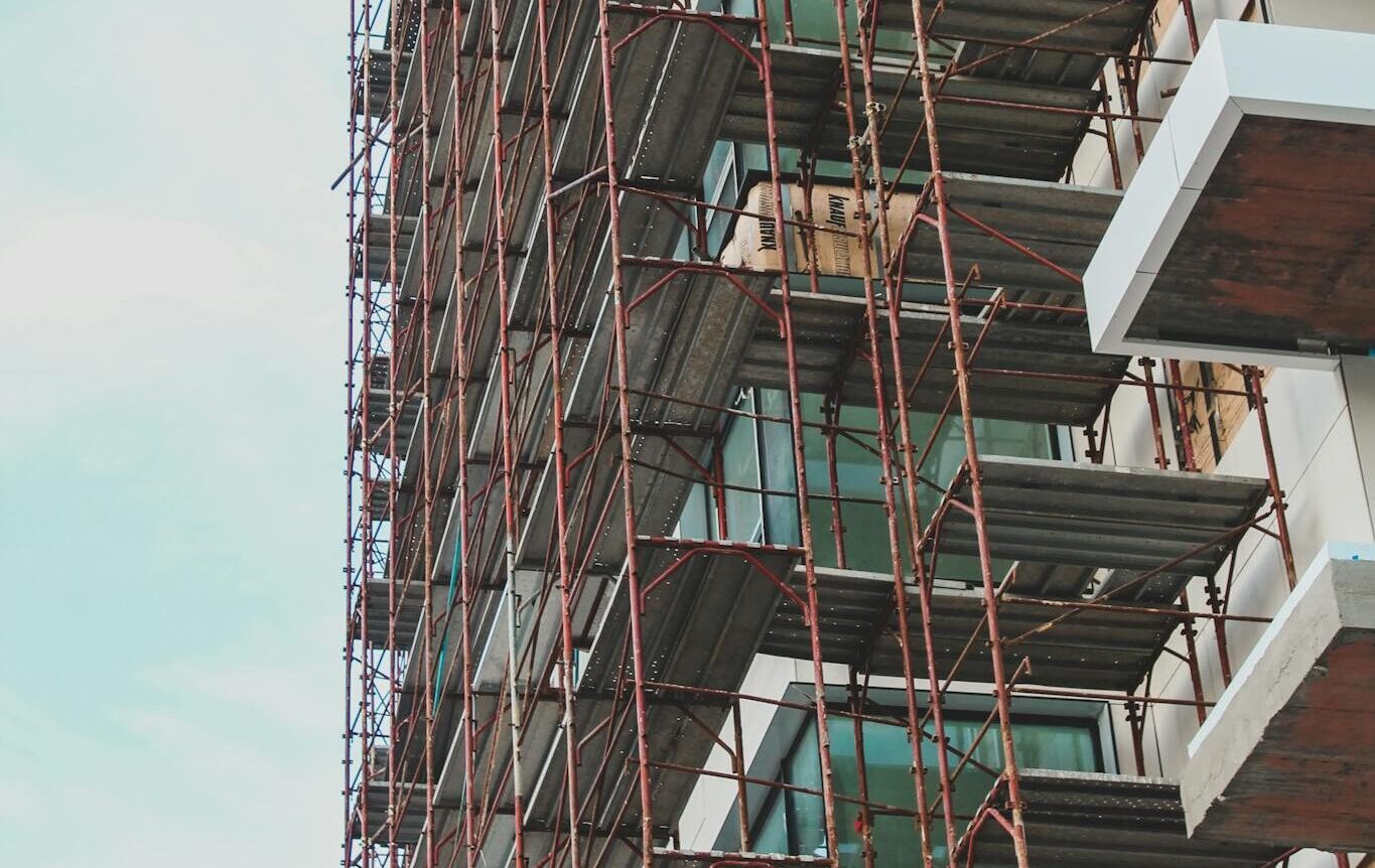 High-rise building in Berlin under construction with visible scaffolding.